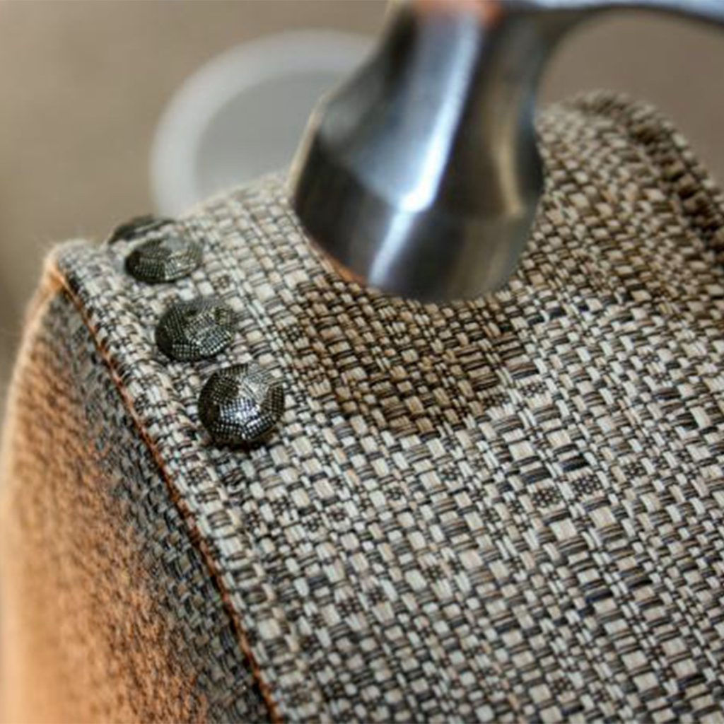 Brimar Hammering Nails Into Upholstered Chair